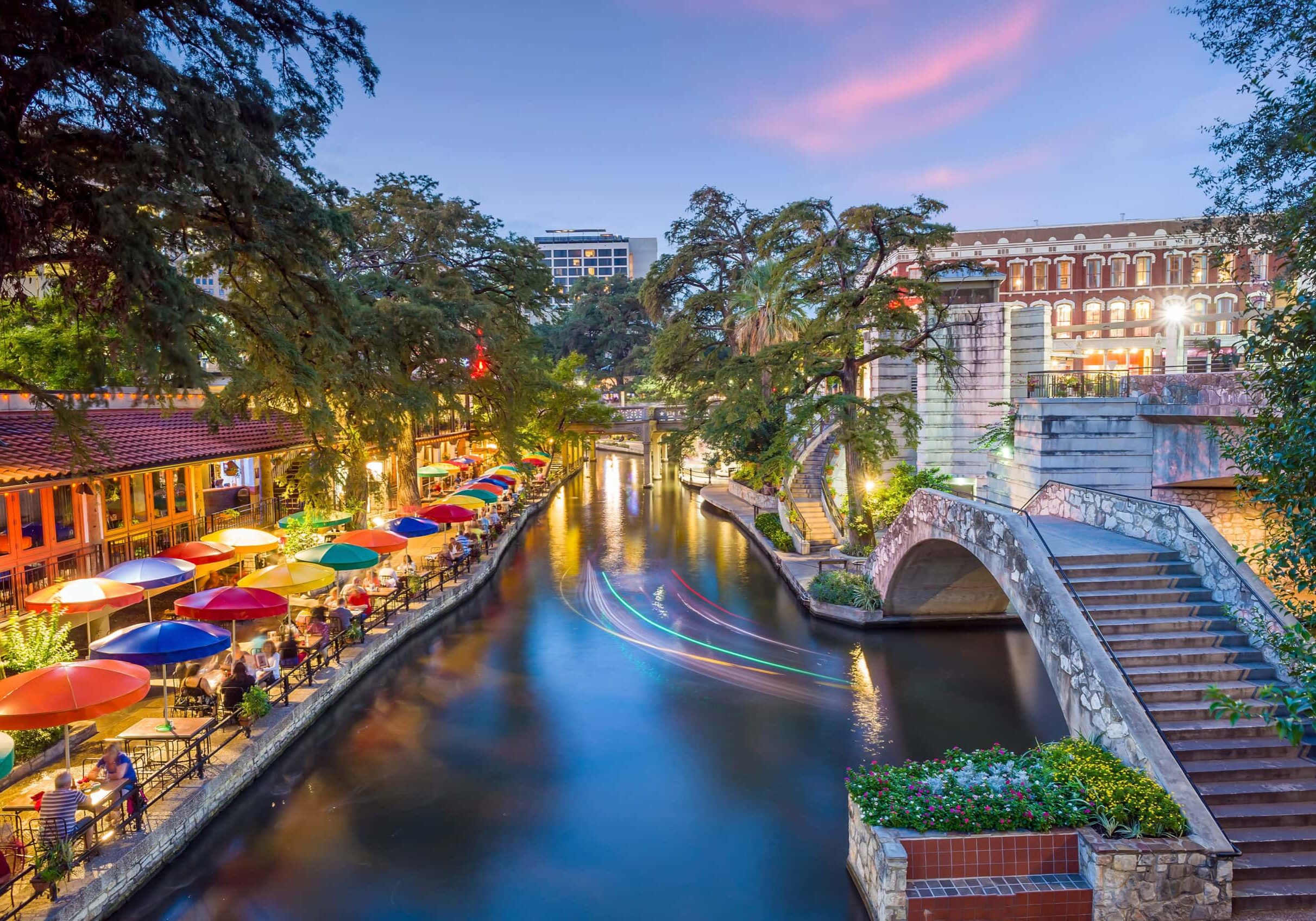 River walk in San Antonio city downtown skyline cityscape of Tex River walk in San Antonio city downtown skyline cityscape of Texas USA at sunset