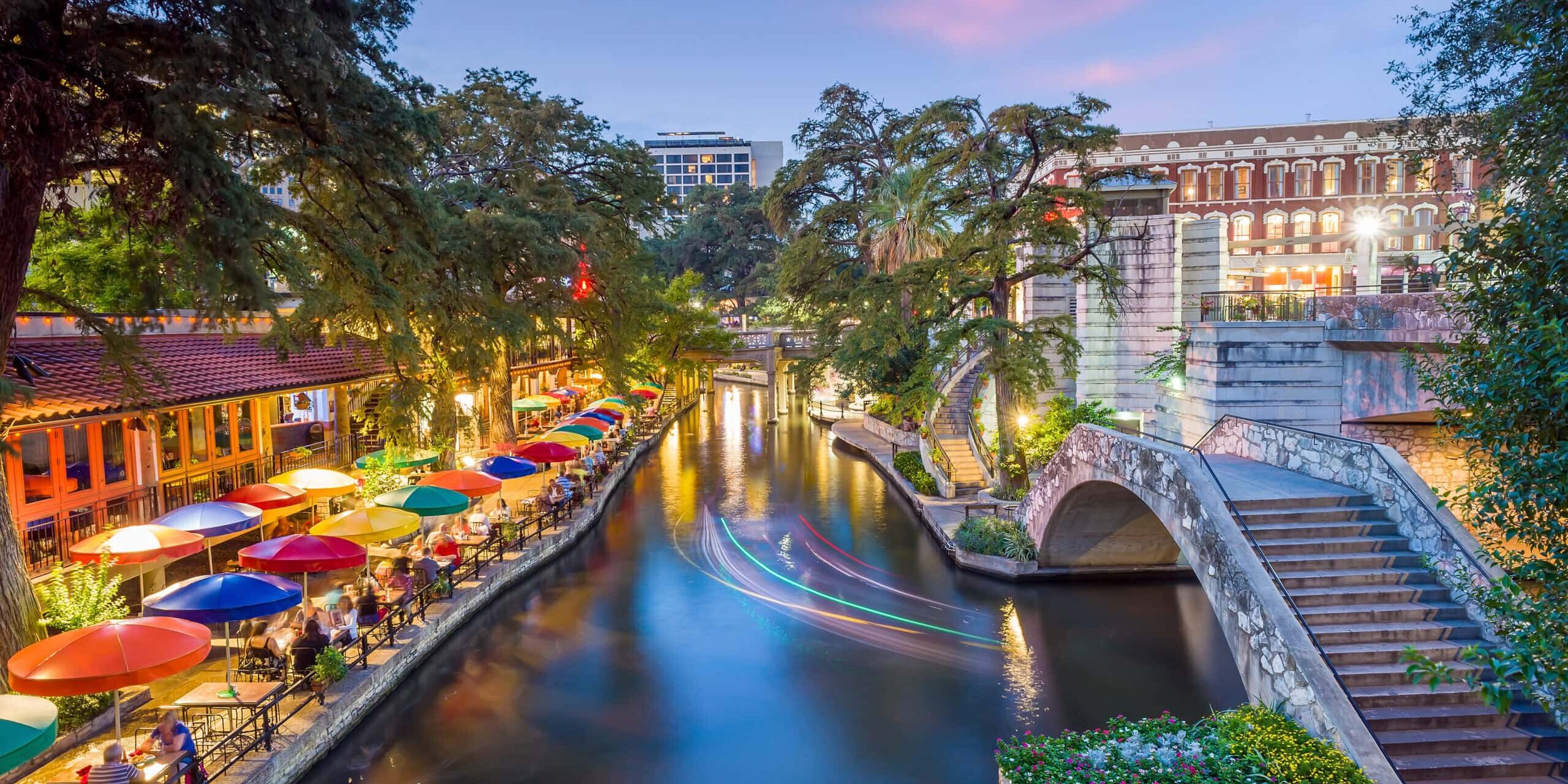 River walk in San Antonio city downtown skyline cityscape of Tex River walk in San Antonio city downtown skyline cityscape of Texas USA at sunset